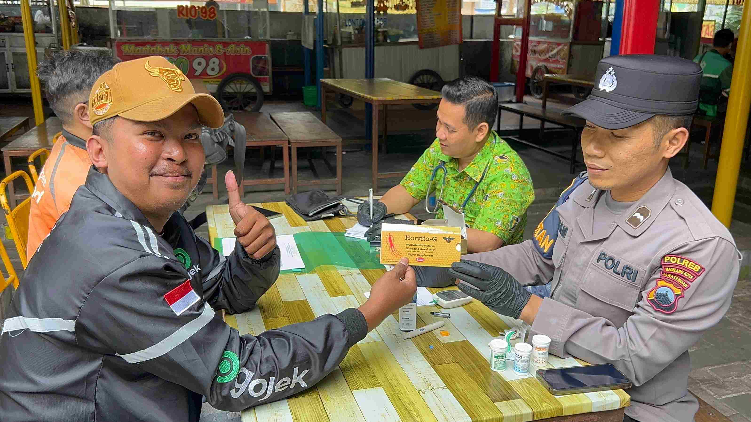 Puluhan Driver Ojol di Kota Magelang Dapat Layanan Kesehatan Gratis dari Polisi di Hari Bhayangkara